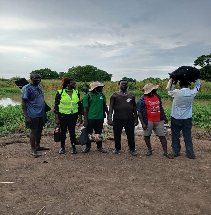 ARDF distribution team gathered at the water's edge before continuing to Uddier Payam.